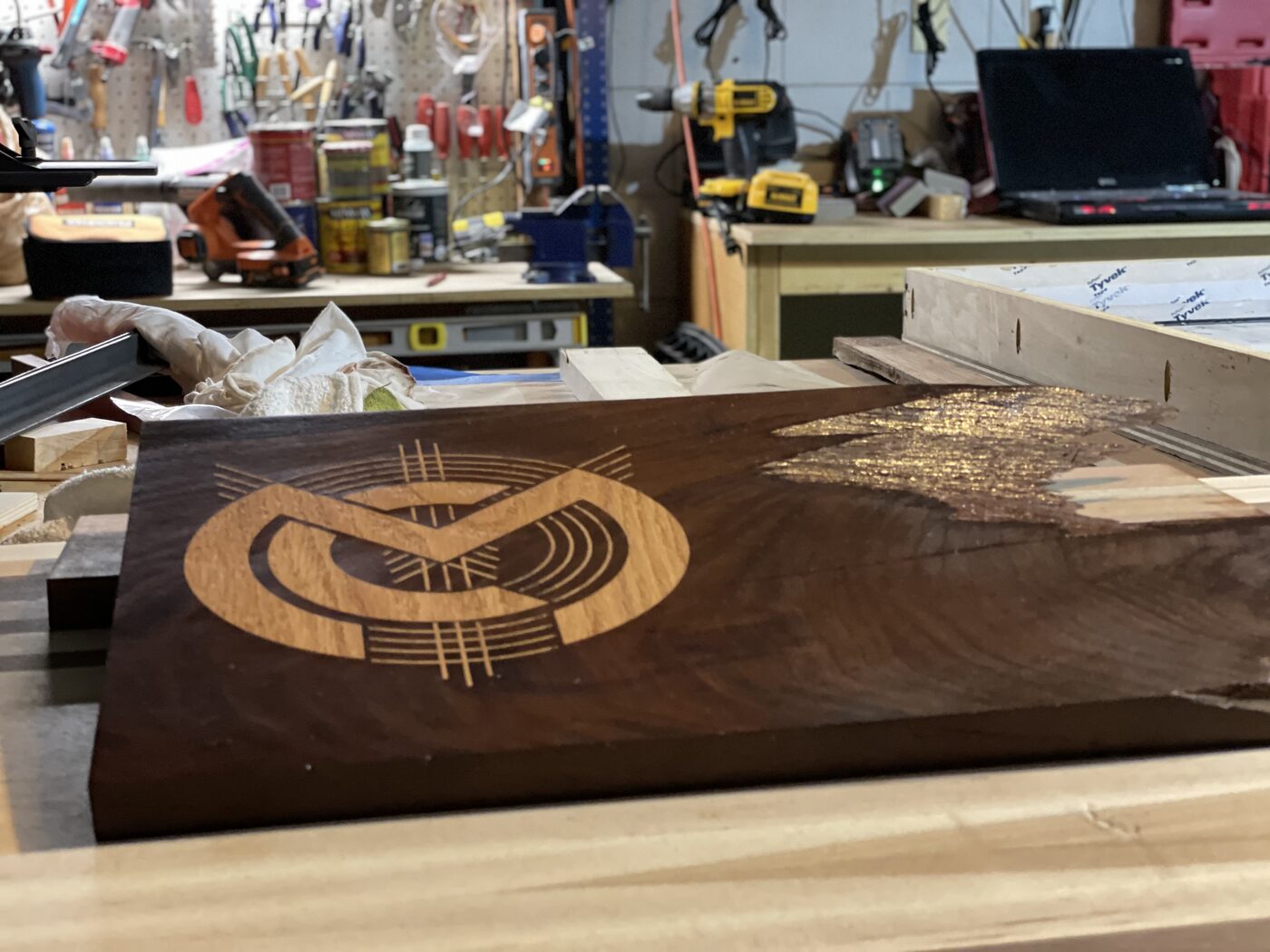 Walnut board with logo in workshop